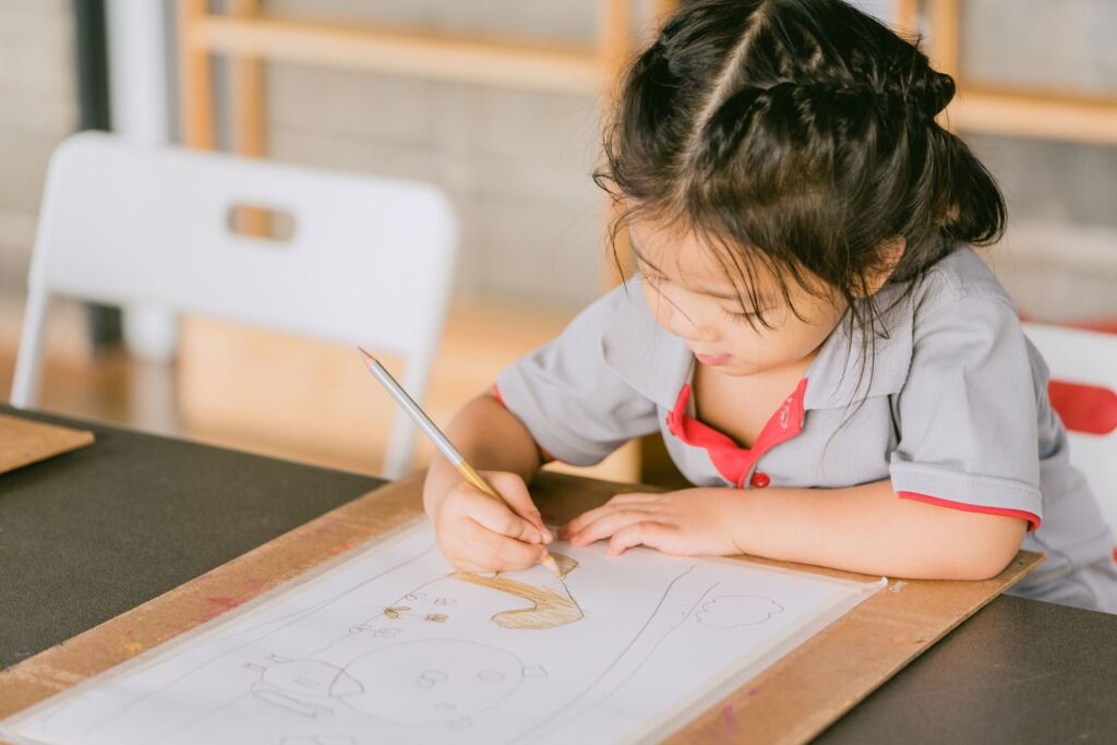 Child Writing in Book - lightstock_517384_download_medium_cody_